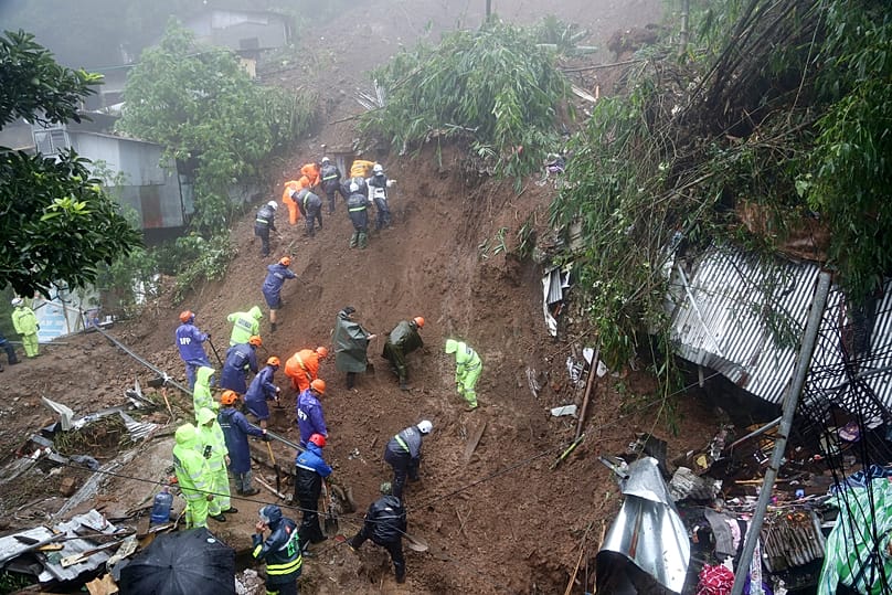 Rescuers conduct search and rescue operations a day after several houses were buried from a landslide due to heavy monsoon rains in Guisad Surong, 10 August, 2026
