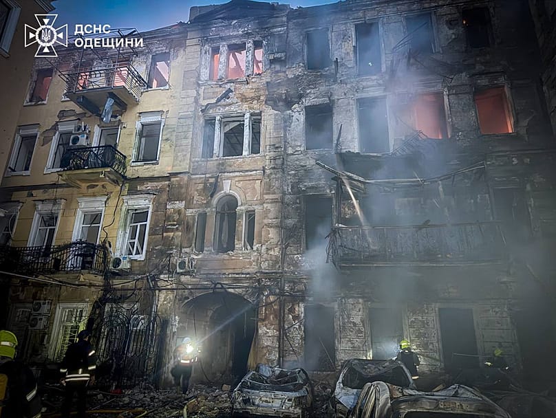 Emergency services personnel work to extinguish a fire of residential buildings following a Russian missiles attack in Odesa, 9 August, 2026