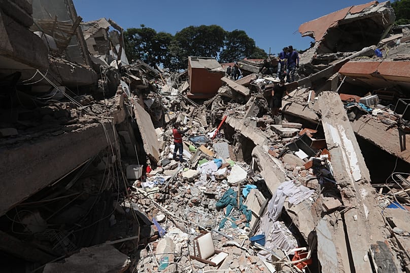Rescue workers and residents search through the rubble after an earthquake struck Cali, 10 August, 2026