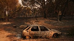 A car burned by a wildfire sits in Piedralaves, 28 July, 2026