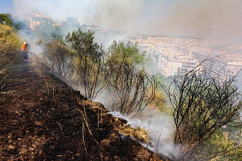 Firefighters work to extinguish a fire in the Monte Ciocci hill in Rome, 31 July, 2026