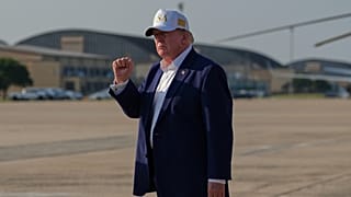 US President Donald Trump gestures as he walks from Air Force One at Joint Base Andrews, 9 August, 2026
