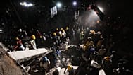 Rescue workers and residents search through the rubble after an earthquake struck Cali, 10 August, 2026