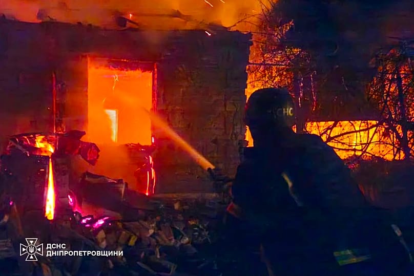 Firefighters work to put out a fire after a Russian air strike on Zaporizhzhia, 11 August, 2026