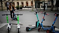 A man parks a scooter in Paris, Friday, march 31, 2023