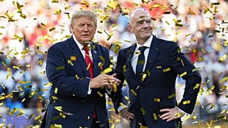 President Donald Trump, left, and FIFA President Gianni Infantino watch confetti fall at the conclusion of the World Cup championship final.