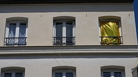 A thermal blanket covers a window to keep out the heat during a heatwave in Saint-Germain-en-Laye, west of Paris, on Thursday 25 June 2026.