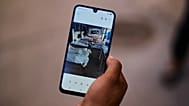 A Ceuta resident shows a photo of body bags containing migrants who died while trying to cross into the Spanish enclave of Ceuta from Morocco, Tuesday, Aug. 4, 2026.