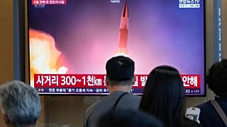 A TV screen shows a file image of North Korea's missile launch during a news program at Seoul Railway Station in Seoul, South Korea, Wednesday, Aug. 12, 2026. (AP Photo/Ahn Yo
