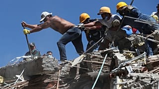 Residents and rescue workers search through the rubble after an earthquake struck Cali, Colombia, Monday, 10 August 2026. 