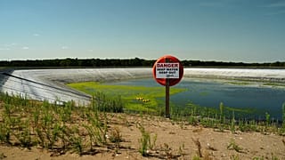 The 'Summer Pit' water reservoir on the Elveden Estate shows low water levels amid a nationwide drought, in Thetford, England, Tuesday, Aug. 11, 2026.