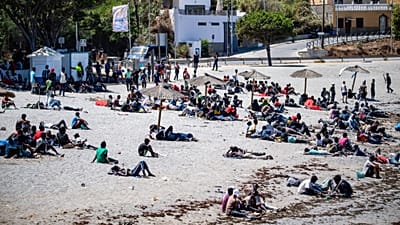 Migrants who crossed into Spain from Morocco gather on a beach in the Spanish enclave of Ceuta, 2 August, 2026