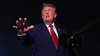US President Donald Trump talks to reporters after arriving at Joint Base Andrews, 11 August, 2026