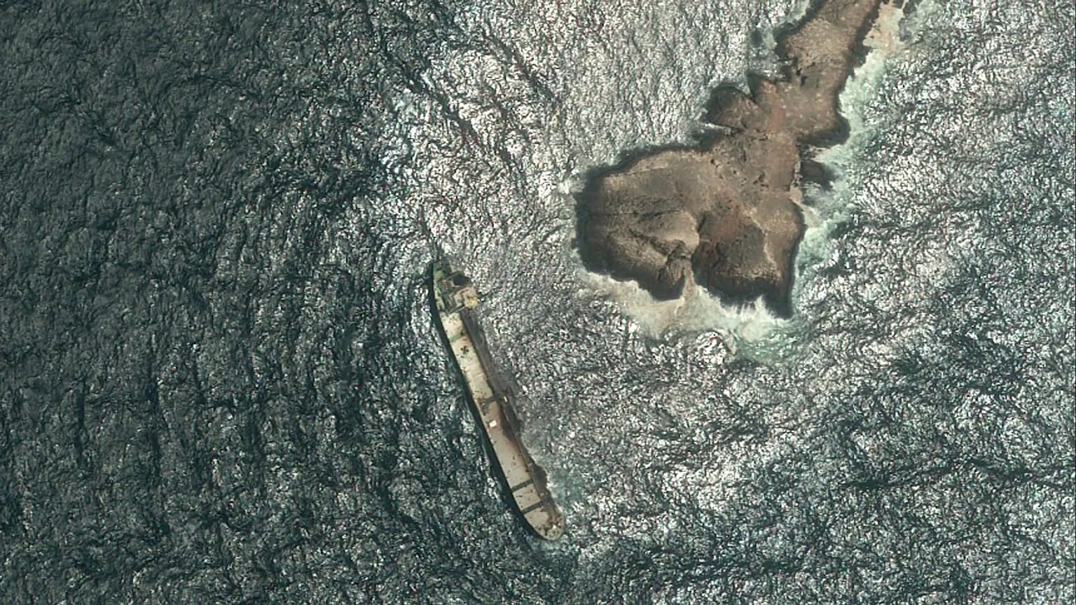 This satellite photo taken Wednesday Aug. 5, 2026, shows the tanker Caroline Bezengi, grounded and partly submerged off the coast of Oman, leaking crude oil into the sea. 