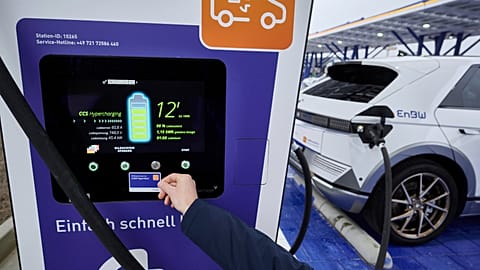An electric car is charged at a charging point at the Kamener Kreuz before the opening of the largest fast-charging park for e-cars to date operated by the energy company EnB 