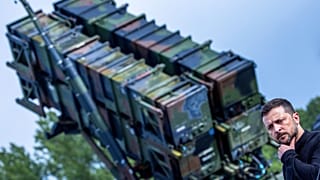 Ukraine's President Volodymyr Zelenskyy stands in front of a Patriot air defence missile system during a visit to a military training area in Western Pomerania, 11 June, 2024