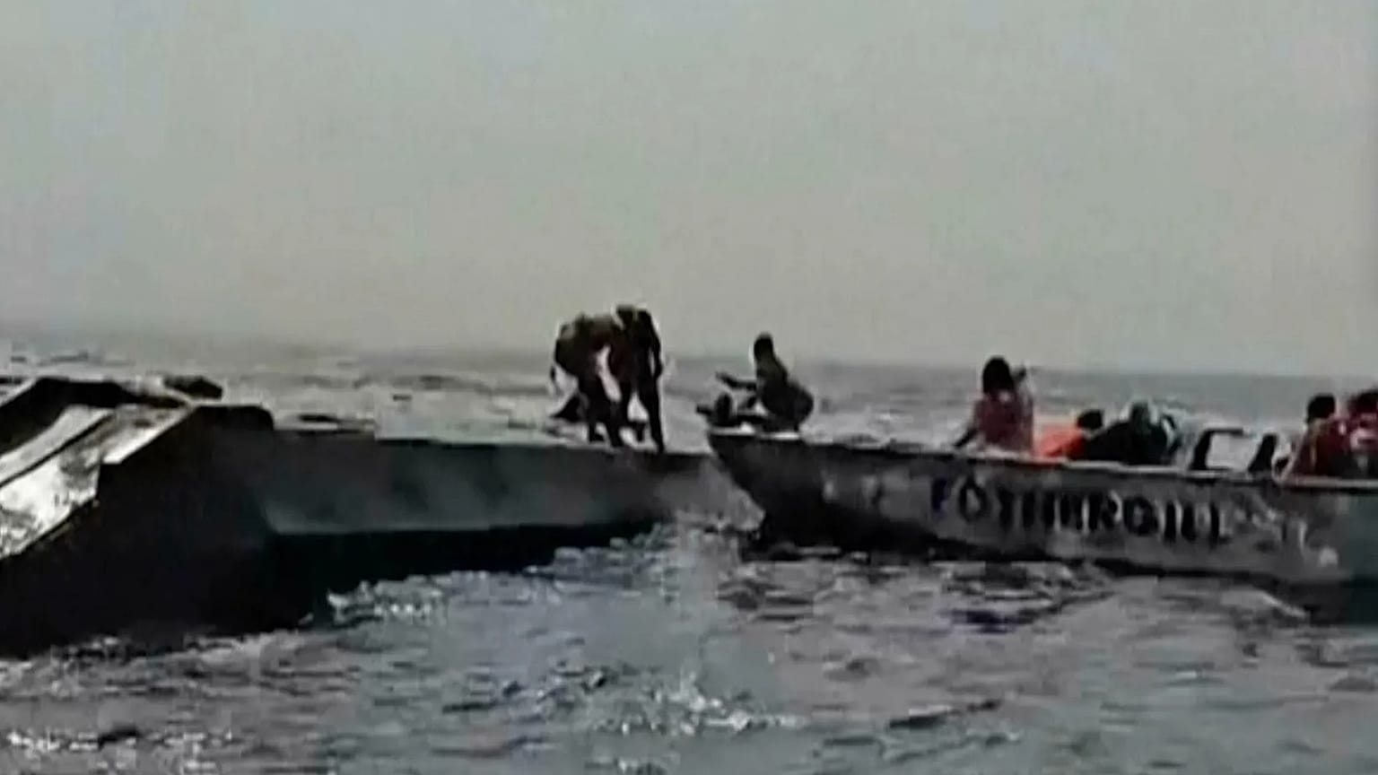 In this image taken from a video people are rescued from an overloaded ferry that capsized on Zimbabwe's Lake Kariba, 11 August, 2026