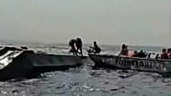 In this image taken from a video people are rescued from an overloaded ferry that capsized on Zimbabwe's Lake Kariba, 11 August, 2026
