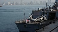 Sailors raise the flag aboard a U.S. Navy ship taking part in a multinational military exercise in Panama City, Thursday, Aug. 13, 2026. (AP Photo/Matias Delacroix)