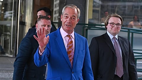 Britain's Reform UK leader Nigel Farage leaves Milbank Tower after he said he'll quit his Parliament seat and seek reelection in London, Tuesday, July 7, 2026.(AP Photo/Thomas