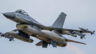 A Royal Danish Air Force jet flies during the NATO military exercises Crystal arrow 2022 at the Adazi military range, Latvia, Friday, March 11, 2022.