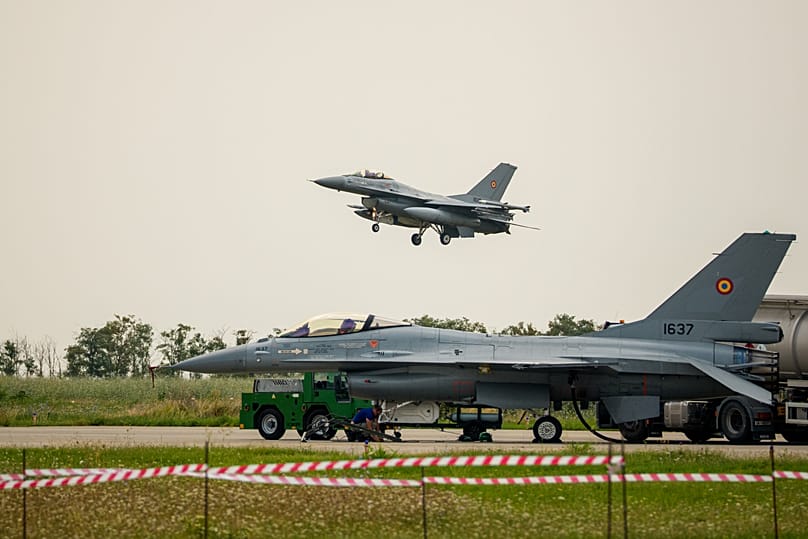 A Romanian F-16 fighter jet flies during an air policing exercise at Borcea Air Base 86, amid heightened security concerns over cross-border drone incursions linked to Russia.
