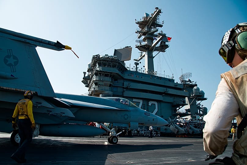 An F/A-18 fighter jet taxis on the deck of the USS Abraham Lincoln aircraft carrier in the Arabian Sea, Monday, June 3, 2019.