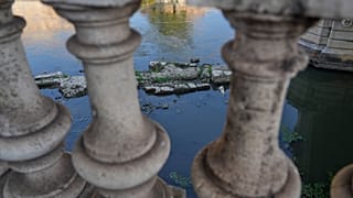 The ruins of the ancient Roman Neronian bridge, emerge from the riverbed of the Tiber river due to drought, in Rome, Thursday, Aug. 13, 2026. 