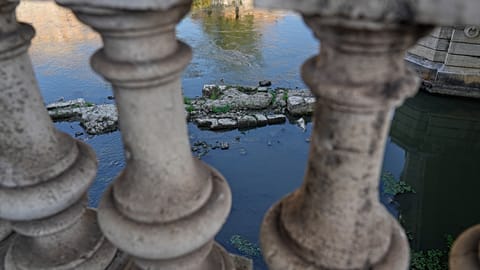 The ruins of the ancient Roman Neronian bridge, emerge from the riverbed of the Tiber river due to drought, in Rome, Thursday, Aug. 13, 2026. 