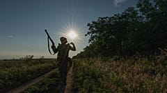FILE: Ukrainian serviceman walks at his position near the frontline city of Kramatorsk, Donetsk region, Ukraine, July 14, 2026