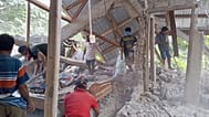People clear up the rubble from a house damaged in an earthquake in East Manggarai, East Nusa Tenggara province, Indonesia, Saturday, Aug. 15, 2026.