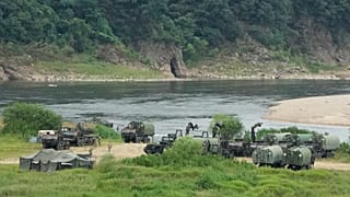 US Army armoured vehicles gather to cross a river at a training field in Yeoncheon, 17 August, 2026