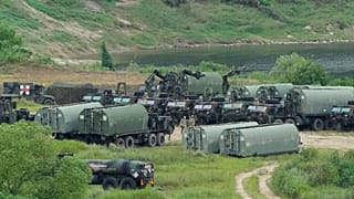 US Army armoured vehicles gather to cross a river at a training field in Yeoncheon, 17 August, 2026