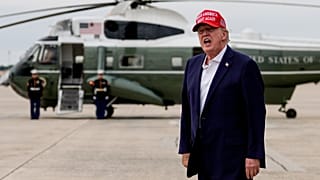 President Donald Trump yells to reporters after disembarking Air Force One, Sunday, Aug. 16, 2026