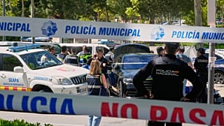 Spanish police officers cordon off an area of Madrid, 21 May, 2025