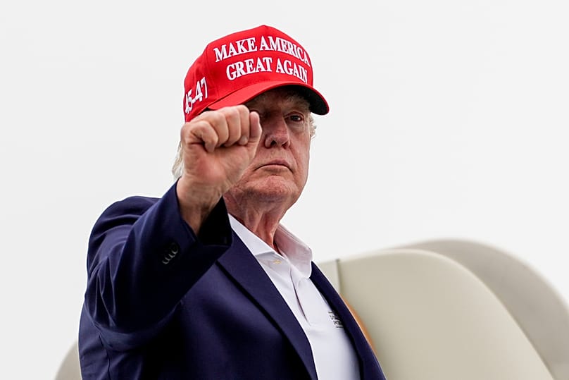 President Donald Trump gestures while boarding Air Force One at Morristown Airport, Sunday, Aug. 16, 2026, in Morristown, N.J.