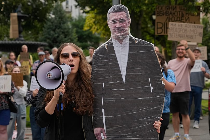 Demonstrators hold a photo of former Mykhailo Fedorov during a rally to denounce Zelenskyy's decision to dismiss Fedorov, Kyiv, Ukraine, July 24, 2026. 