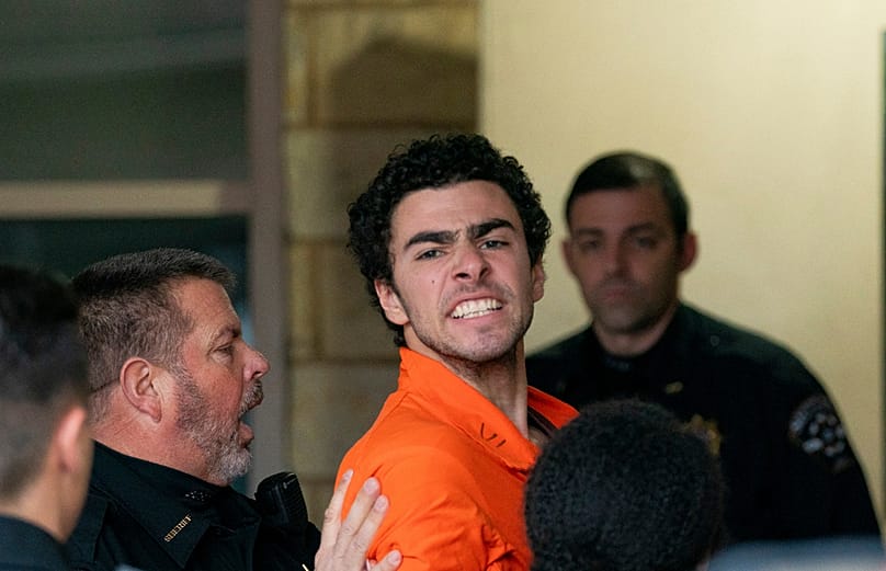 FILE - Suspect Luigi Mangione is taken into the Blair County Courthouse on Tuesday, Dec. 10, 2024, in Hollidaysburg, Pennsylvania
