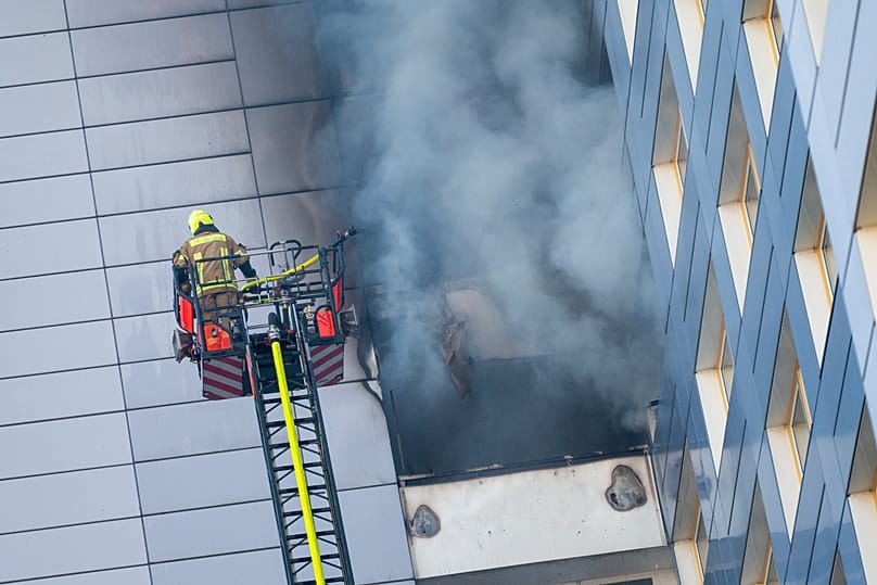 Firefighters work at extinguishing a fire in a high-rise building in Friedrichshain, 14 August, 2026