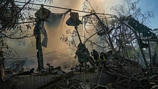 A rescue workers put out a fire of a building destroyed after a Russian aerial attack in Kharkiv, 1 June, 2026