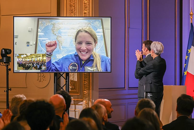 French President Emmanuel Macron and former French astronaut Claudie Haignere speak with French astronaut Sophie Adenot in Paris, 5 February, 2026