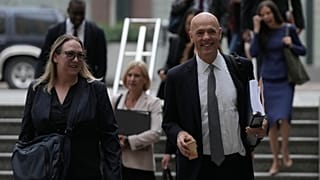 Attorney Paul W. Schmidt, representing Meta, right, arrives at a Federal Courthouse Wednesday, Aug. 12, 2026, in Oakland, California, US. 