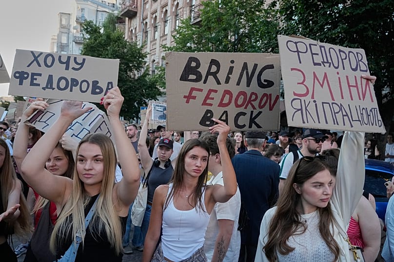 Activists shout slogans during a rally to denounce Volodymyr Zelenskyy's decision to dismiss Defense Minister Mykhailo Fedorov after six months in the post, July 17, 2