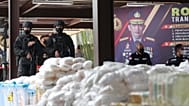 Indonesian police stand guard near confiscated illegal drug methamphetamine during a news conference in Jakarta, 28 April, 2021