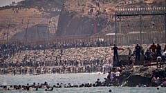 Migrants cross from Morocco into the Spanish enclave of Ceuta, 30 July, 2026