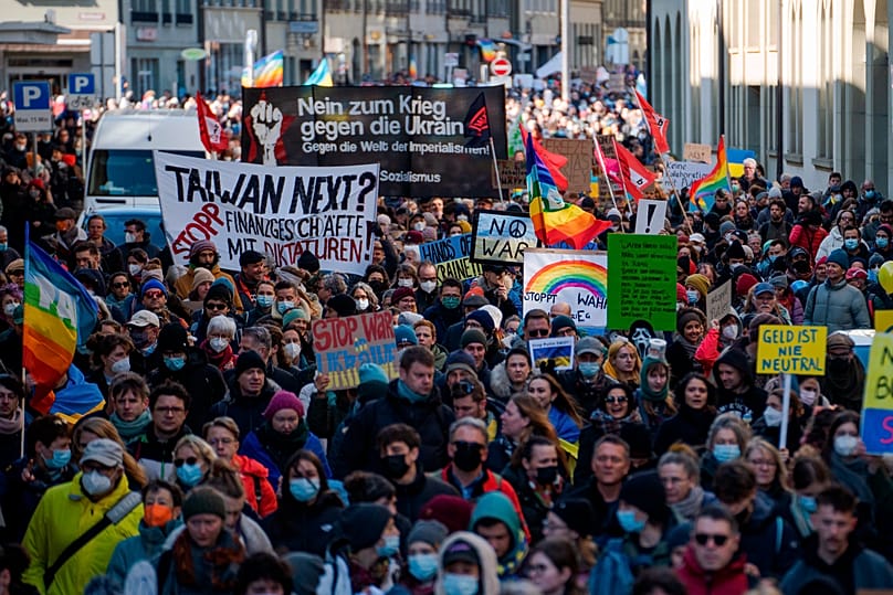 Protestors take part in a demonstration against Russia's military intervention in Ukraine in Bern, 26 February, 2022