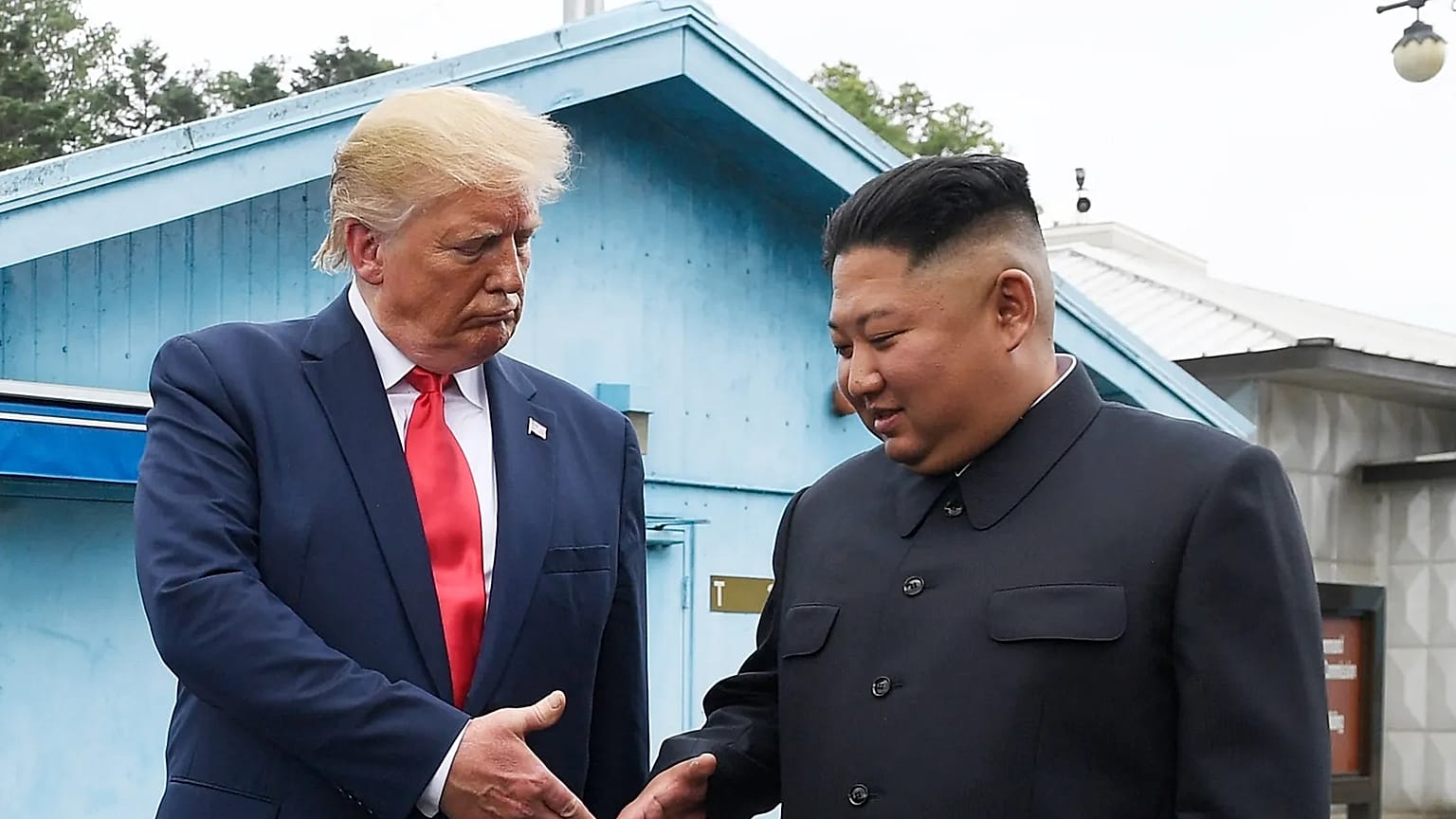 North Korean leader Kim Jong Un, right, and U.S. President Donald Trump shake hands at the border village of Panmunjom in the Demilitarized Zone on June 30, 2019.