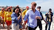 FILE - Prince Harry, and Meghan Markle, walk after meeting volunteer first responders from Bondi Surf Bathers' Life Saving Club, Australia, Friday, April 17, 2026