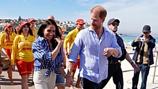 FILE - Prince Harry, and Meghan Markle, walk after meeting volunteer first responders from Bondi Surf Bathers' Life Saving Club, Australia, Friday, April 17, 2026