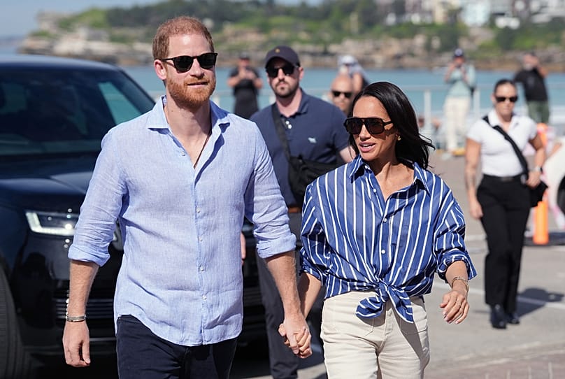 FILE - Prince Harry, and Meghan, the Duke and Duchess of Sussex, arrive for an event, during a visit to Bondi Beach, Australia, April 17, 2026